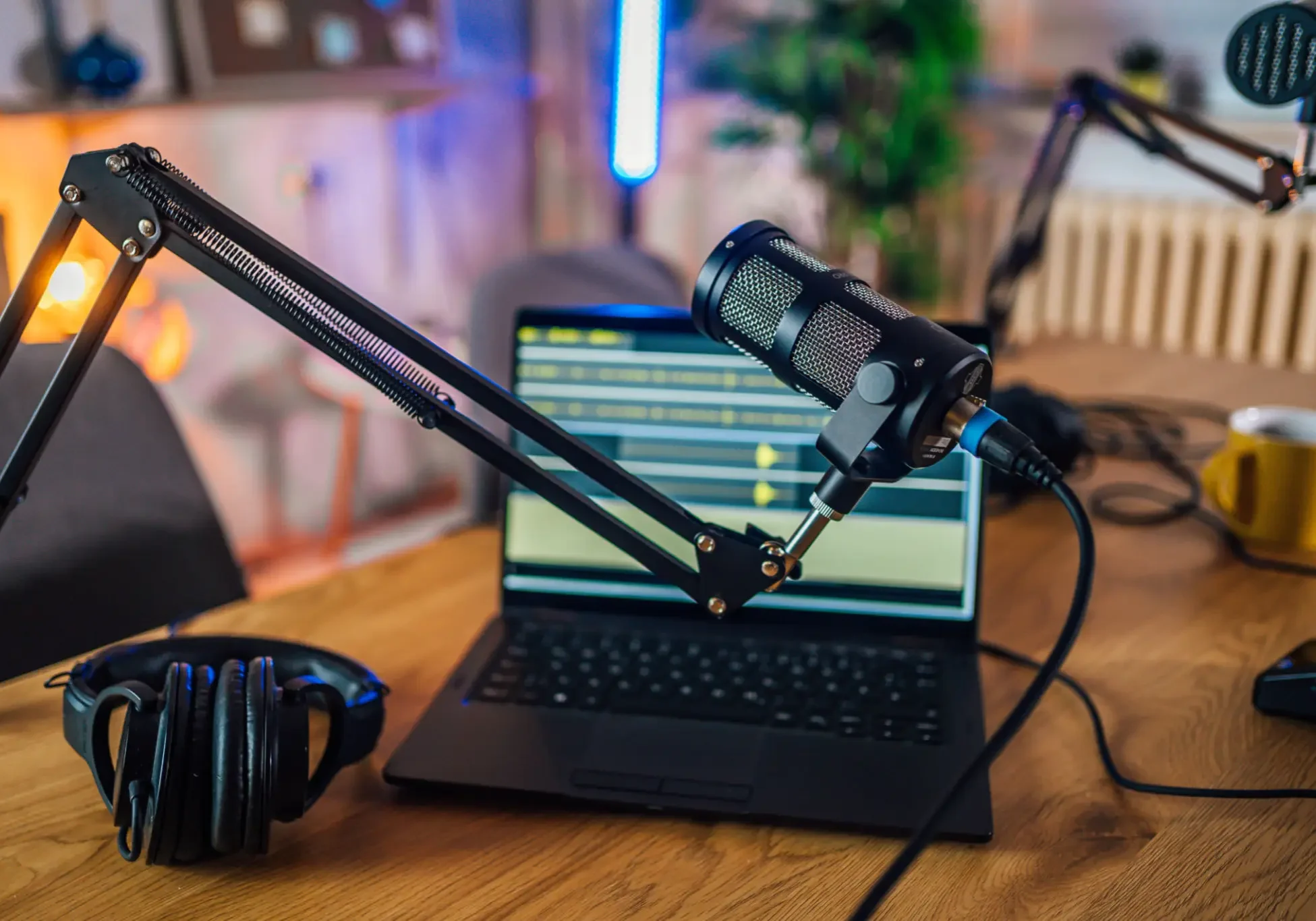 Desk with recording equipment and laptop